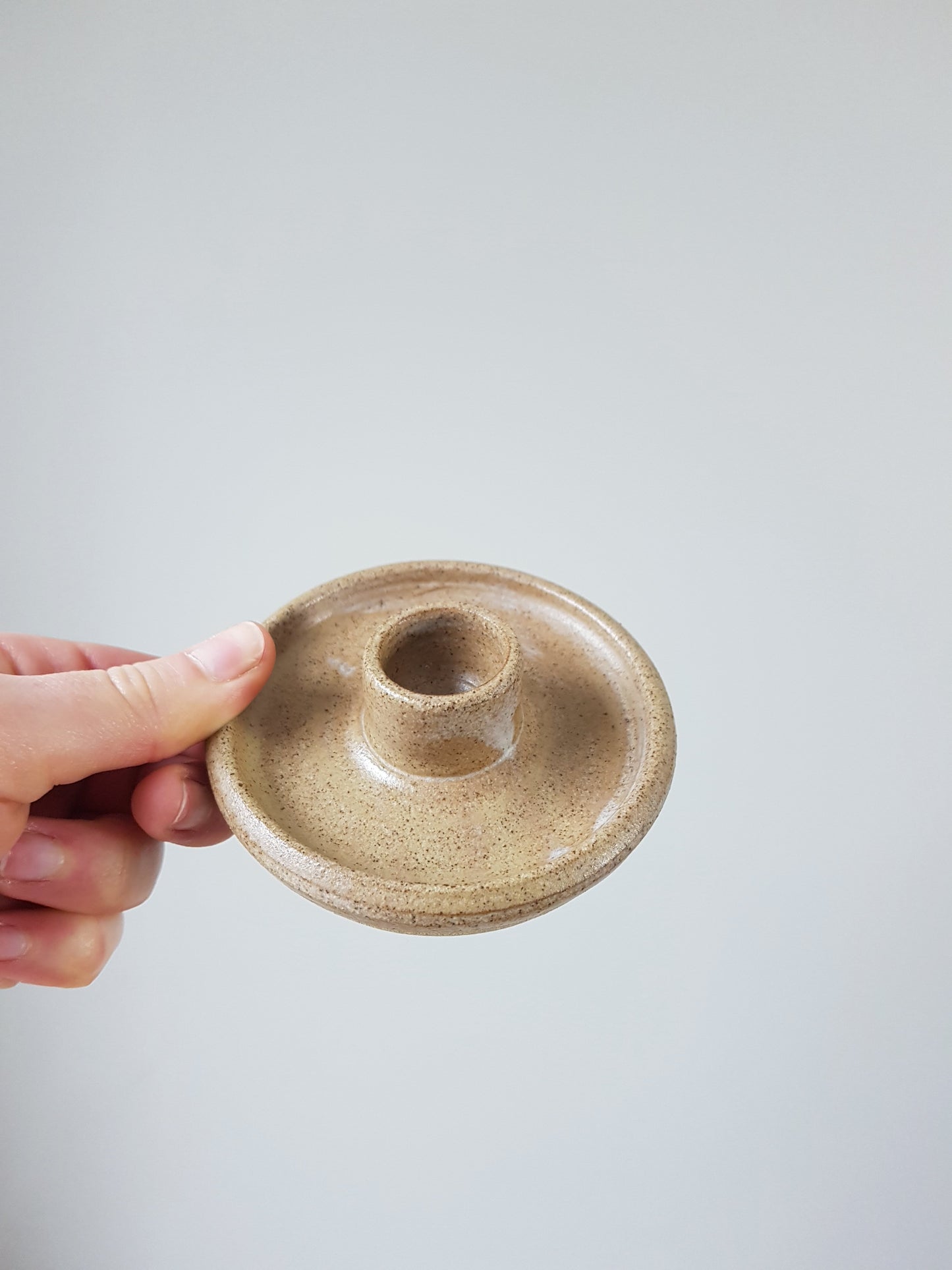 Brown speckled candlestick holder